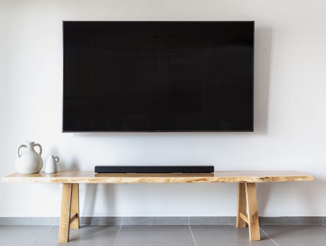 TV mounted on wall in living room